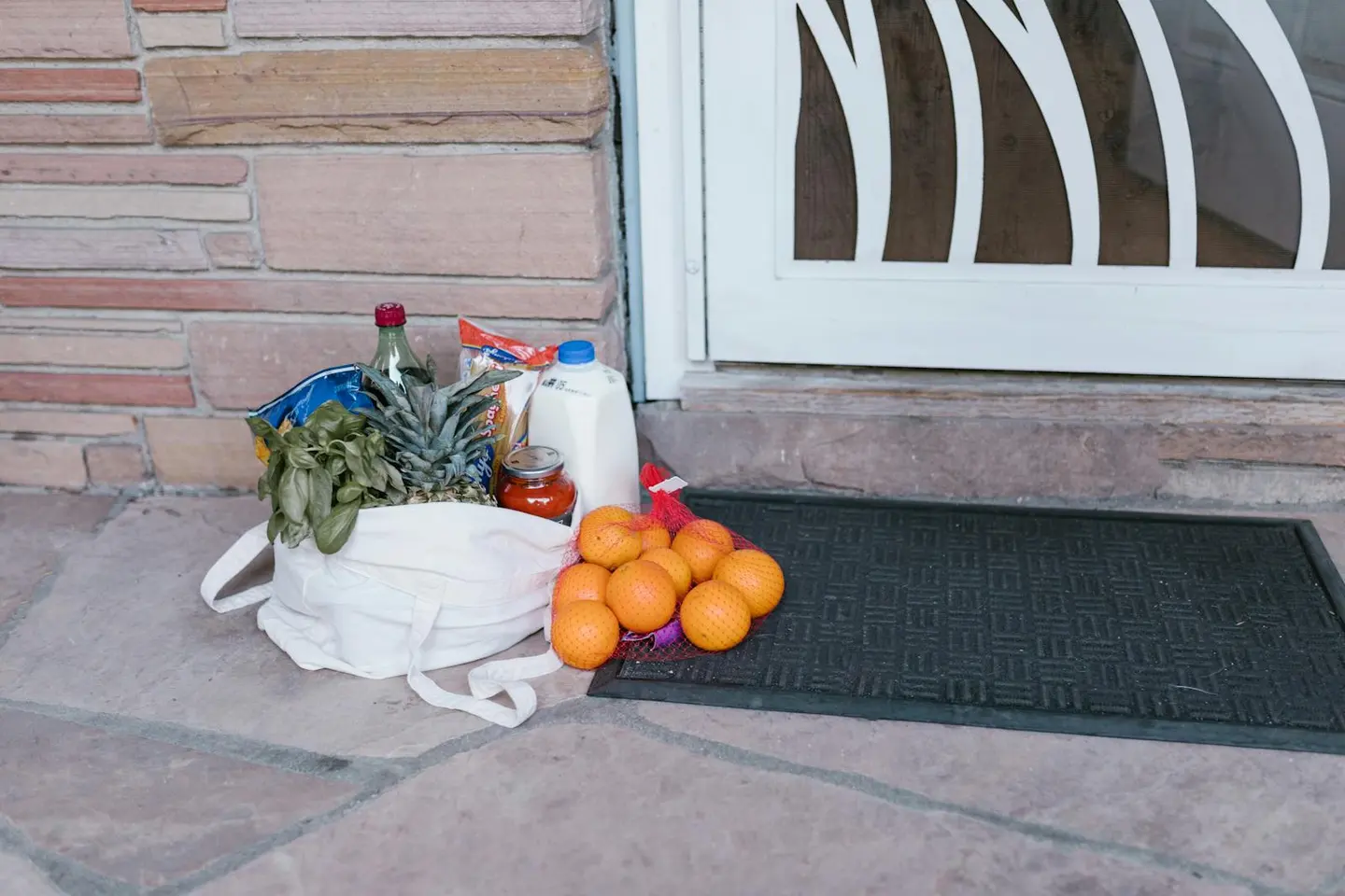 Reusable bag waiting at an apartment doorway for pickup